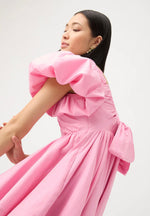 Load image into Gallery viewer, Gretta Bow Back Mini Dress in Ballet Pink - Aje
